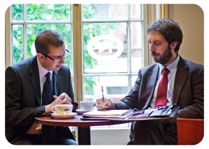 Colleagues discussing work in a business meeting in Peterborough 