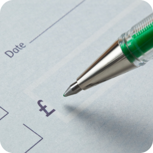 Funding support in Peterborough. A pen poised and ready to write a cheque