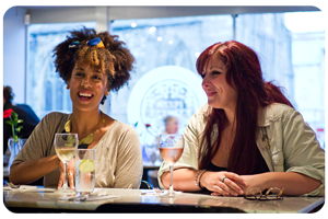 Friends chatting over dinner in one of many lovely restaurants in Peterborough