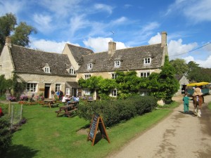 The exterior of the Watermill and Mill House in summer
